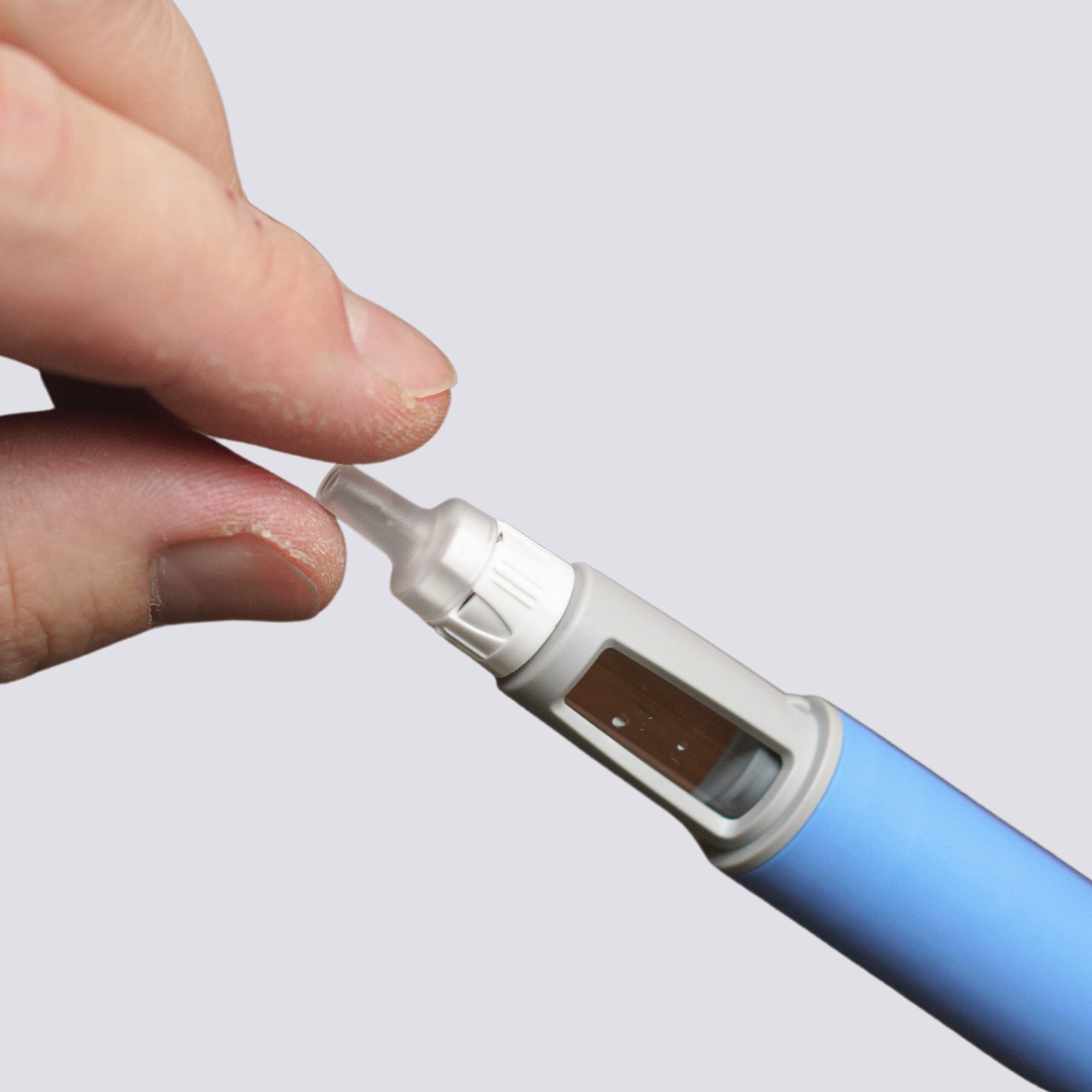 Man injecting Ozempic pen for weight management